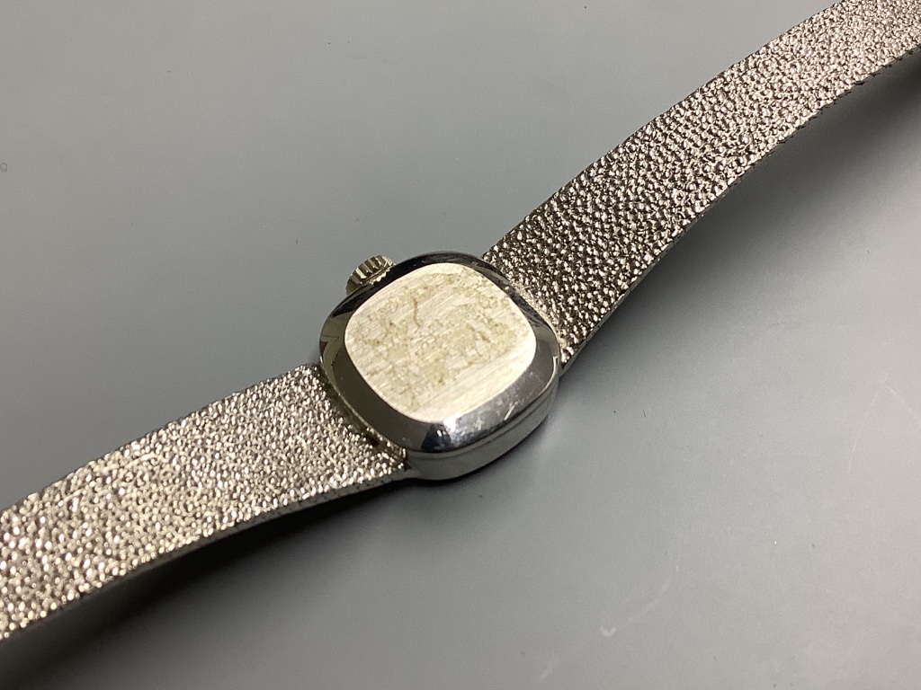 A lady's modern 9ct white gold Tissot manual wind wrist watch, on integral Tissot 9ct white gold bracelet, 17.5cm
